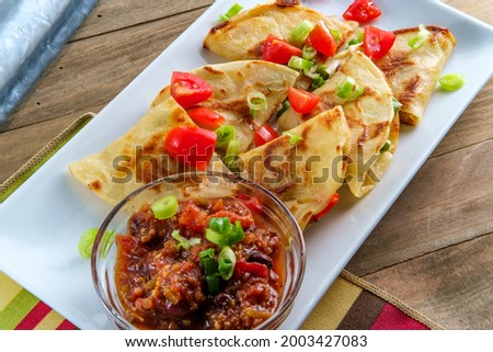 Vegetarian Mexican pepper jack cheese quesadillas with black bean salsa