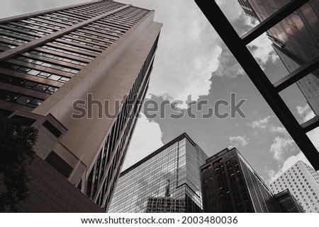Modern Hong Kong Architecture; Hong Kong Business Building Close up; black and gold color tone