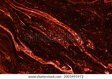 Lava texture background. Flow magma pattern, red and black color flows wallpaper, volcano lava with copy space