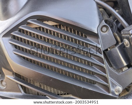 Motorcycle radiator guard in automatic motorcycle