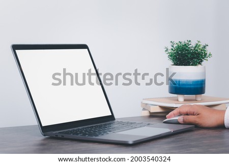 computer screen blank mockup.hand woman work using laptop with advertising,contact business search information on wooden desk at office, marketing and creative design concept.