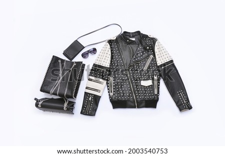 Set of leather jacket on hanging and with black two handbag , boots