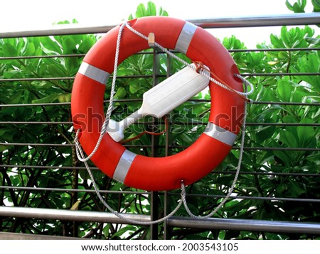lifebuoy with rope, Lifebuoy on dock, Rescue equipment for emergency on water                    