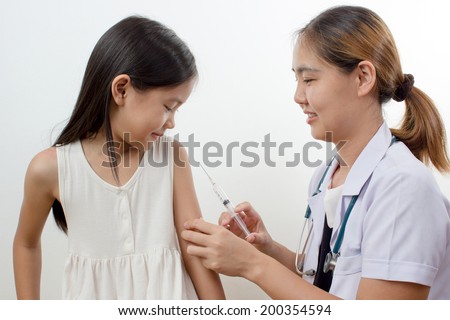 Doctor give injection to Asian girl's arm