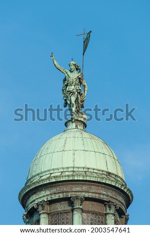 View over San Simeone Piccolo Catholic Church (Chiesa di San Simeon Piccolo), its top dome with statue of Roman man pointing with hand towards sky in Venice, Italy.