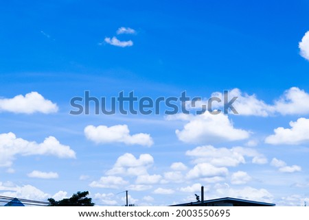 Clear Blue sky with many white clouds. layer of clouds. Freshly of sky in the morning, soft clouds, home roof