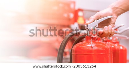 fire extinguishers available in fire emergencies. Royalty-Free Stock Photo #2003613254
