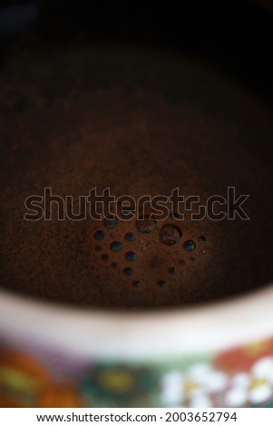 Coffee bubbles in a coffee cup