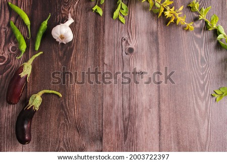 Composition with wooden board and ingredients for cooking on table. with free space for text. Top view.