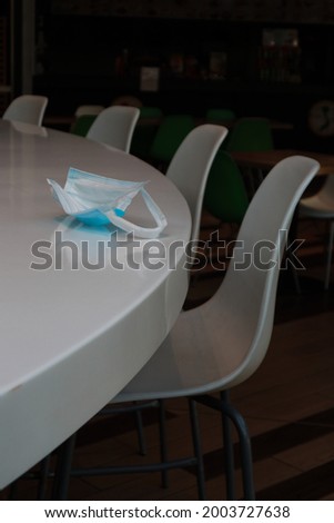 an empty cafe, no people, empty tables and chairs