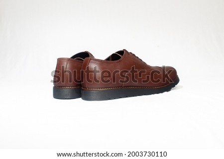 brown leather shoes longwing type men use a white background with angle shot eye level