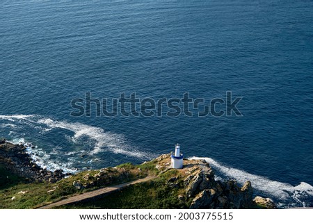 Da Porta lighthouse in Illa do Faro, one of the Cies Islands in Atlantic Islands of Galicia National Park, Spain. Royalty-Free Stock Photo #2003775515