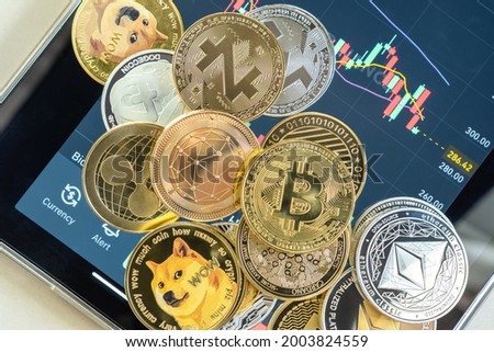 Cryptocurrency on Binance trading app, Bitcoin BTC with BNB, Ethereum, Dogecoin, Cardano, Litecoin, altcoin digital coin crypto currency defi p2p decentralized finance and fintech banking market Royalty-Free Stock Photo #2003824559