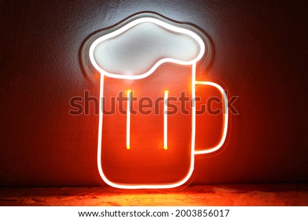 White and orange neon sign glass of beer. Trendy style. Neon sign. Custom neon. Summer vibe.