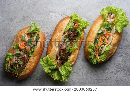 Bahn mi is a Vietnamese baguette with soft inner texture usually filled with various meat that is tasty. Royalty-Free Stock Photo #2003868257