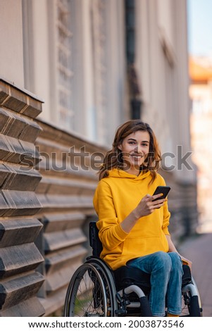 Portrait of disabled woman, noticing that her picture is being taken.