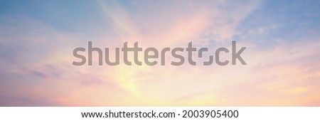 sky panorama Natural colors Evening sky Shine new day for Heaven, The light from heaven from the sky is a mystery, In the twilight golden atmosphere,Modern sheet structure design, New Banner Web 2022	 Royalty-Free Stock Photo #2003905400