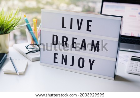 Live,dream,enjoy,ext on lightbox business motivation concepts.happy with work