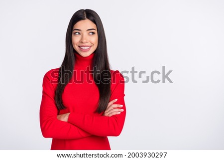 Photo of young smiling cheerful beautiful korean woman with folded hands look copyspace isolated on grey color background