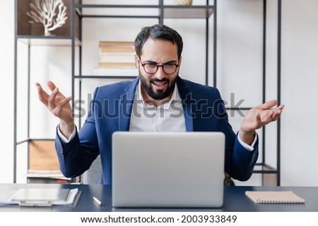 Angry disappointed confused businessman dealing with job problems, failure, troubles with occupation. Stress, workaholism on huge load on remote freelance work. Royalty-Free Stock Photo #2003933849