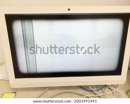 Broken computer monitor , white color with damaged monitor