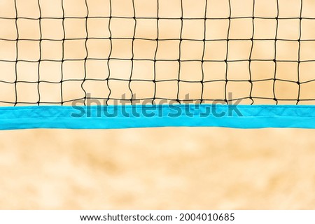 Beach volleyball and beach tennis net on the background of sand. Summer sport concept.