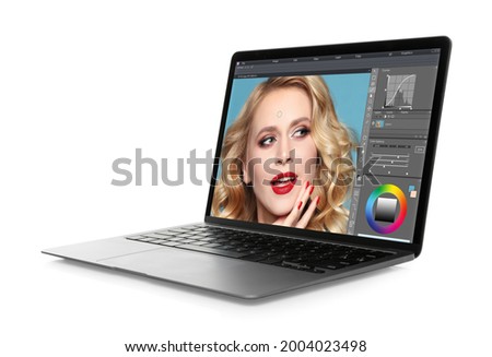 Laptop with photo editor application isolated on white