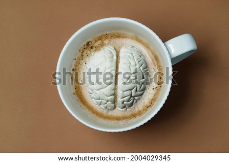 Brain submerged like marshmallow in coffee cup