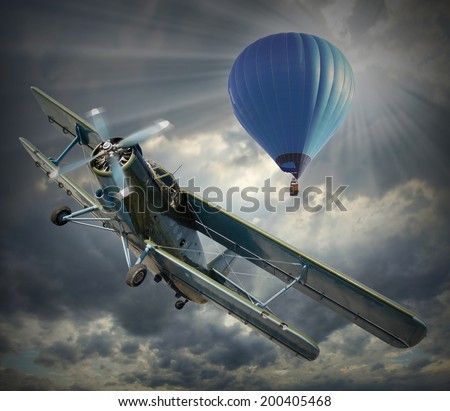 Retro style picture of the biplane and hot air balloon. History of aeronautics concept.