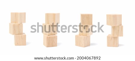Three stacked geometric wooden cube blocks. isolated on a white background. Royalty-Free Stock Photo #2004067892