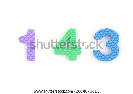 number 143 isolated on white background. Colorful letters on background close up. Alphabet toy. Number one hundred forty three.