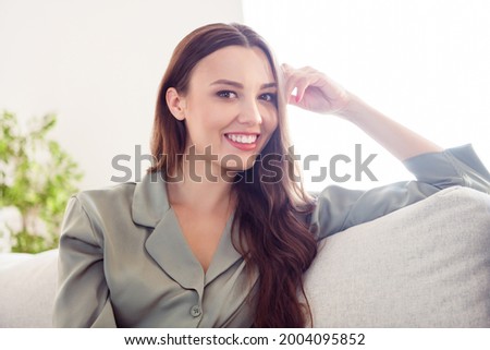 Photo of young attractive cheerful girl happy positive smile sit couch home rest relax wear pajamas home