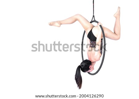 Beautiful woman Asian sport girl  fly yoga posing on hoop isolated white background , Aerialist gymnastics performs physical exercises - yoga concept