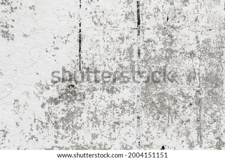 Old with cracks and spots, cement plaster walls, light background.