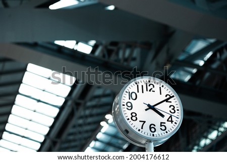 Large Clock in airport terminal Building.