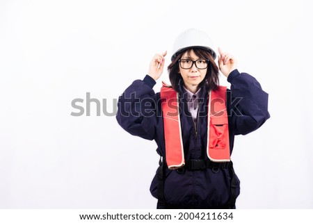 Engineer woman pointing at helmet