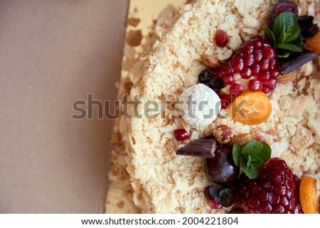 Happy birthday mood concept. Birthday cake decorated with fruits and sweets. Copy space. 