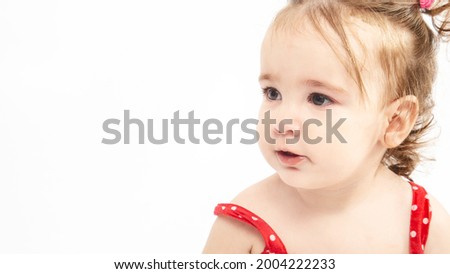 Cute small baby girl on white background Childhood concept. adorable child. Happy emotion. Copyspace. Horizontal banner