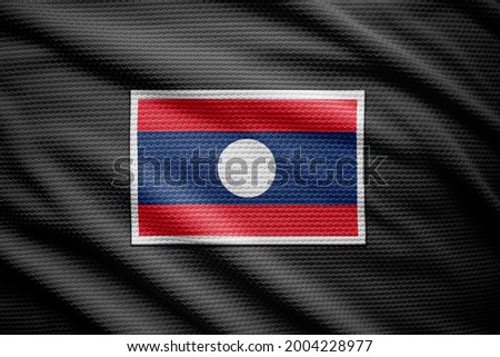Laos flag isolated on black jersey. National symbols of Laos.