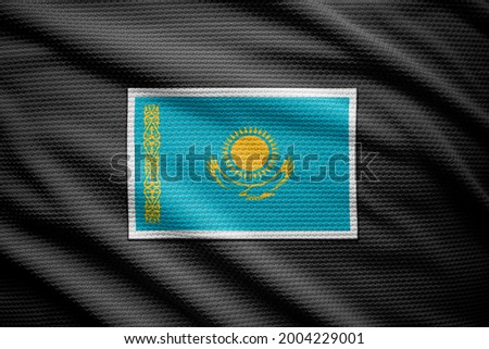 Kazakhstan flag isolated on black jersey. National symbols of Kazakhstan.