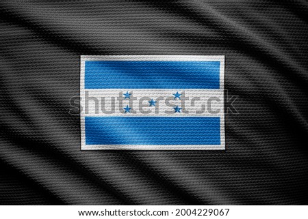 Honduras flag isolated on black jersey. National symbols of Honduras.