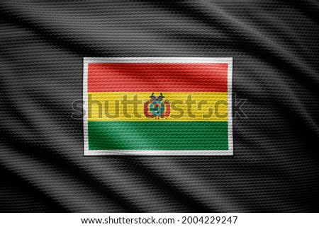 Bolivia flag isolated on black jersey. National symbols of Bolivia.