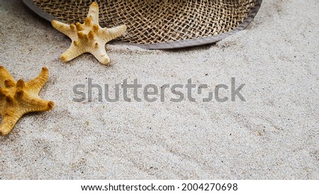 straw hat sea and stars on the sand.