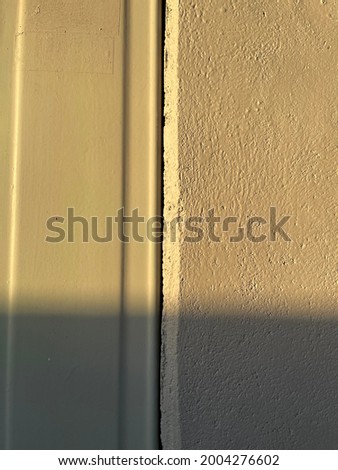 the orange light of the sun on the wall