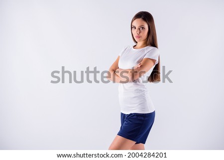 Portrait of her she nice-looking attractive lovely pretty content sportive serious straight-haired girl folded arms isolated on light white gray pastel color background