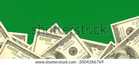 Dollars border banner background on green office table, business concept photo with copy space