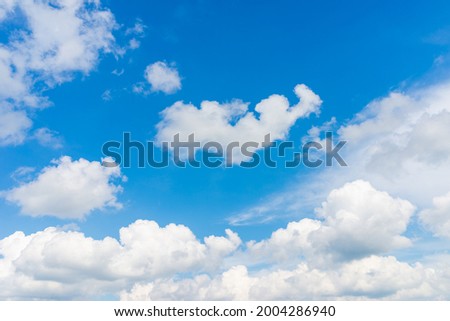 White and gray clouds in blue sky.nice day during the hot spring or summer season.copy space.Blue heaven clear day. Royalty-Free Stock Photo #2004286940