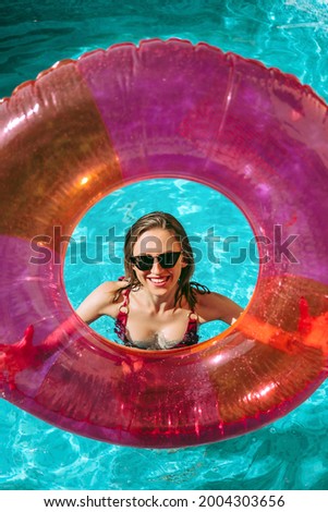 Cheerful woman in a pool