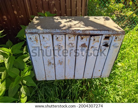 old iron mailboxes on the street in the summer season