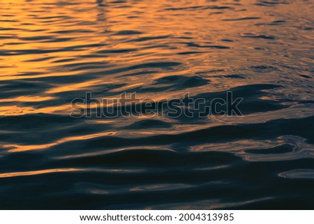 macro texture of the water surface, sea waves at different times of the day.